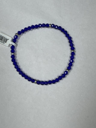 Cobalt blue faceted bead bracelet with silver spacer accents.
