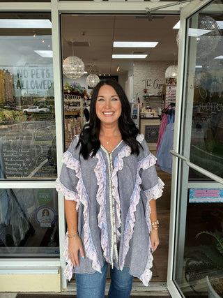 Oli & Hali Lavender & Blue Stripe Ruffle Top: Chic and stylish sleeveless blouse with elegant ruffle details.