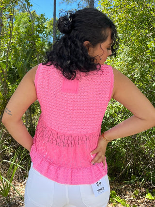 Bright pink textured sleeveless tank top with ruched waist detail and chest pocket.
