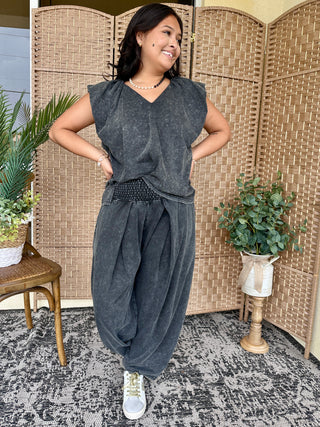 Charcoal mineral wash sleeveless tank top and balloon pants set on model.
