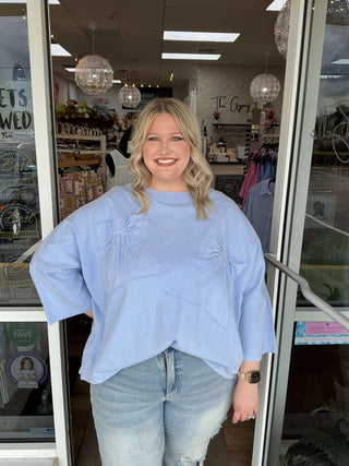 Blue Velvet Bow Patch Oversized Top, Available in Two Colors – Stylish and Comfortable for Any Wardrobe Update.