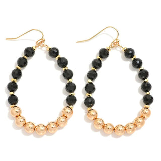 Elegant Black Faceted & Gold Bead Teardrop Earrings on display - perfect for adding a touch of sophistication to any outfit.
