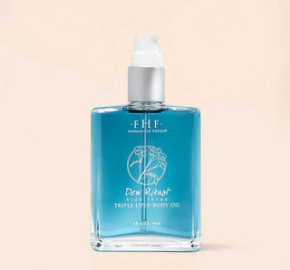 FHF Dew Ritual Blue Tansy Triple Lipid Body Oil 4 oz in elegant glass bottle on white background.