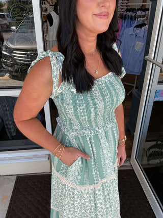 Listicle Maxi Dress in Sage Floral, featuring a smock design with tiered ruffles and elegant long sleeves.