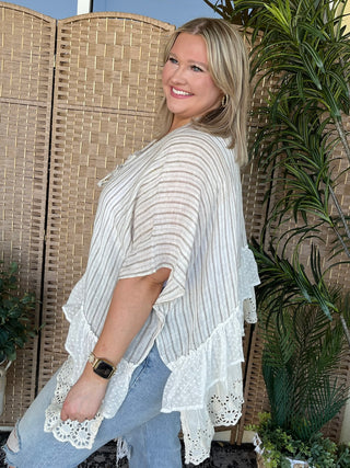 Cream and taupe striped kimono with white lace ruffled hem and three-quarter sleeves.
