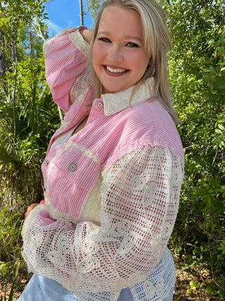 Pink and white striped button-up shacket with cream lace sleeves and collar detail.
