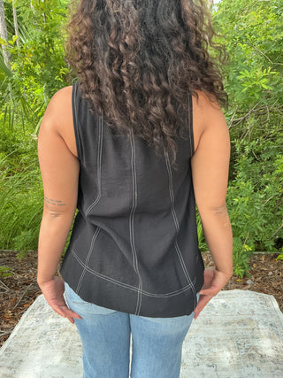 Light blue sleeveless layering tank with contrast stitching and a relaxed fit