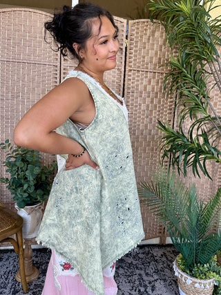 Oversized olive green tank top with eyelet embroidery detail and raw frayed edges.
