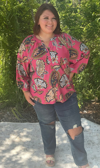 Pink and navy paisley puff sleeve top with a relaxed fit and round neckline