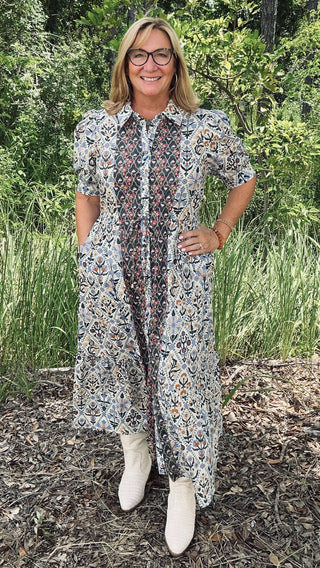 Diamond Floral Pattern Charcoal Accent Midi Dress by Entro on a hanger against a plain background, showcasing elegant details.