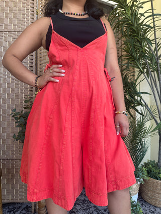 Bright red denim camisole dress with sweetheart neckline and full skirt, styled with black crop top.
