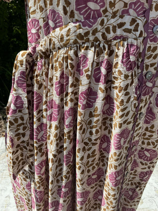 Orchid floral midi dress with button front and scallop trim, featuring a fitted bodice and flowing skirt