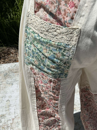 Ivory jogger pants with a floral patchwork design and elastic waistband for a relaxed fit