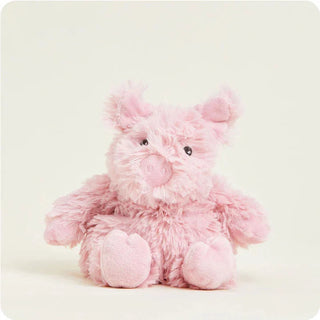 A cute Warmies Pig Junior Microwavable Plush in pink with embroidered features, perfect for cozy warmth and comfort.