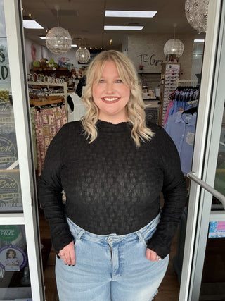 Stylish black round neck lace top with bows and long sleeves, perfect for layering and elegant occasions.