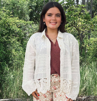 Ivory long sleeve top with crochet hem and embroidery by Adora, featuring a button-down design perfect for chic styling.