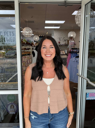 Women’s crochet button-front vest top available in two colors, displayed on hanger against a textured white background.