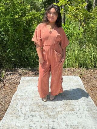 Paprika spice mineral wash jumpsuit with a drawstring hem and relaxed fit