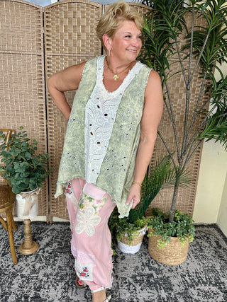 Oversized olive tank top with white eyelet lace trim and V-neckline.