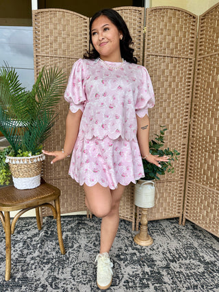 Pink floral short set with puff sleeves and scalloped trim hem.
