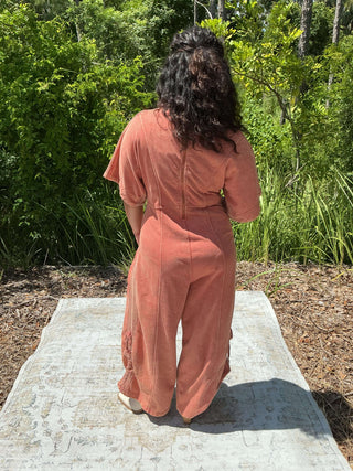 Paprika spice mineral wash jumpsuit with a drawstring hem and relaxed fit