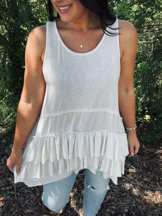 Ivory sleeveless tunic top with tiered ruffle hem, perfect for a chic, breezy look. Sew In Love brand.