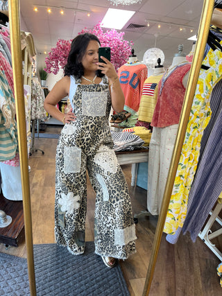 Leopard print and cream crochet patchwork wide leg overalls with sleeveless design.
