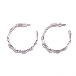 Elegant Silver Cinched Hoop Earrings with textured design, perfect for adding a touch of sophistication to any outfit.
