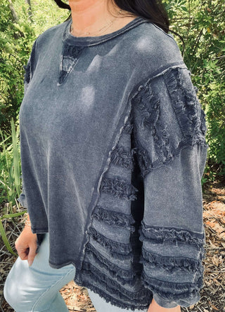 Stylish oversized Easel long sleeve top with washed terry fringe stripe contrast, available in three colors.