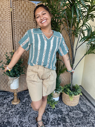 Jade crochet top with white vertical stripes and lace detailing, short sleeves, collared neckline.
