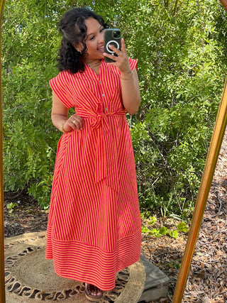 Hot pink and orange striped midi dress with tie waist and short sleeves.
