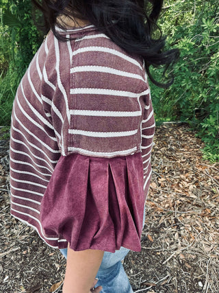 Striped textured top with contrast puff sleeves in two colors from ee:some, showcased on a mannequin for a stylish look.