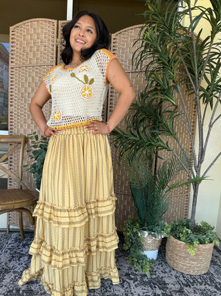 Cream open crochet sleeveless top with citrus fruit embroidery and orange trim detail.
