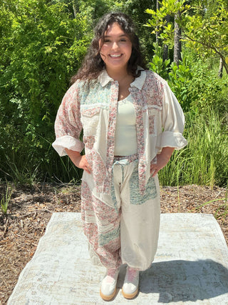 Ivory hi-lo shacket top with floral print and crochet detail