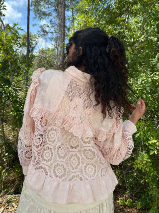 Blush pink lace shacket with puff sleeves and eyelet detailing over cream skirt.
