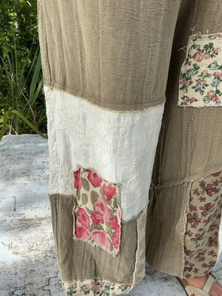 Ivory jogger pants with embroidered details and patchwork accents in an oversized fit