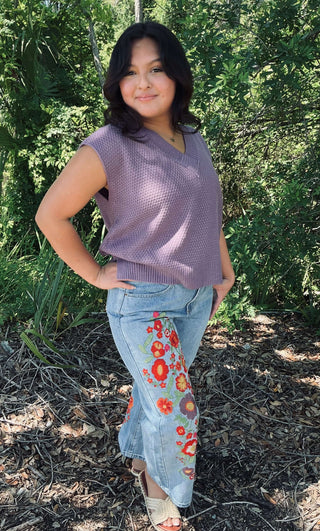 Model wearing Doe & Rae V Neck Textured Knit Sweater, available in two colors, showcasing a chic, cozy winter style.