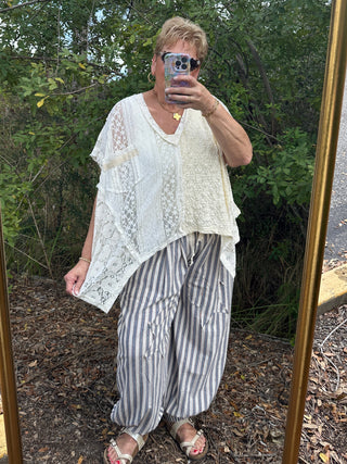 Blue and white striped jogger pants with relaxed fit and cuffed ankles.
