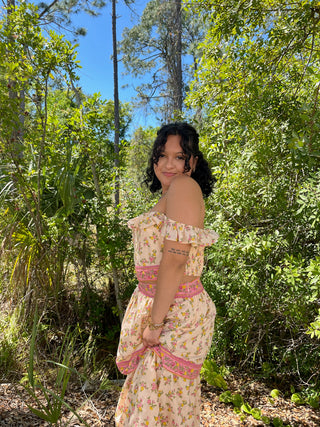 Peachy pink floral off-shoulder crop top and maxi skirt set with pink trim detailing.
