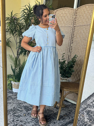 Blue and white striped midi dress with puffed short sleeves and button-front closure.
