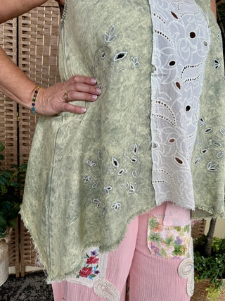 Olive linen tank top with white embroidered floral details and eyelet trim.