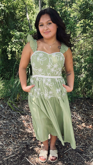 &Merci Matcha Green Floral Embroidered Midi Dress with delicate floral patterns and elegant design, displayed on a neutral background.