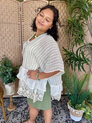 Gray and white striped kimono top with white lace ruffled hem and three-quarter sleeves.
