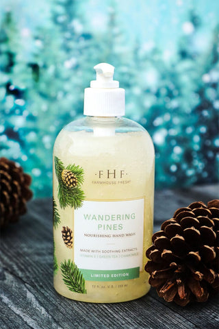 FHF Wandering Pines hand wash bottle with white pump dispenser and pine cone graphic on label.
