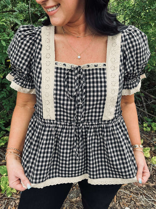 Elegant black & taupe gingham puff sleeve peplum top by Listicle, perfect for stylish and sophisticated looks.