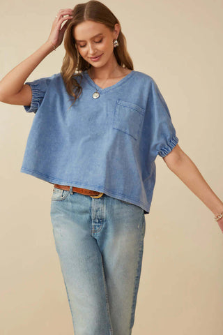 Denim Blue Mineral Washed Cap Sleeve Top with Pocket, showcasing its stylish and casual design on a mannequin.
