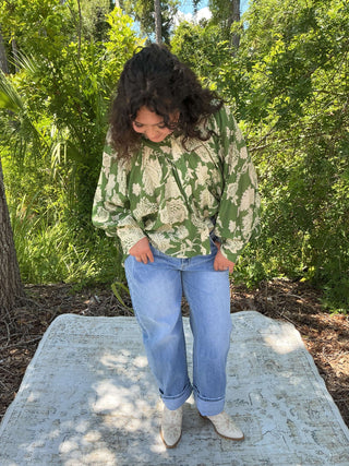 Emerald green jacquard print long sleeve top with bubble sleeves and a relaxed fit