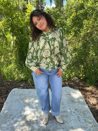 Emerald green jacquard print long sleeve top with bubble sleeves and a relaxed fit