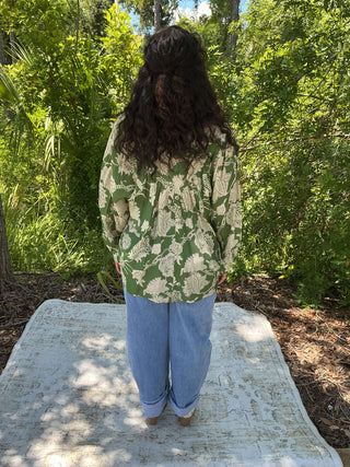 Emerald green jacquard print long sleeve top with bubble sleeves and a relaxed fit