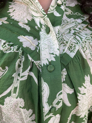 Emerald green jacquard print long sleeve top with bubble sleeves and a relaxed fit